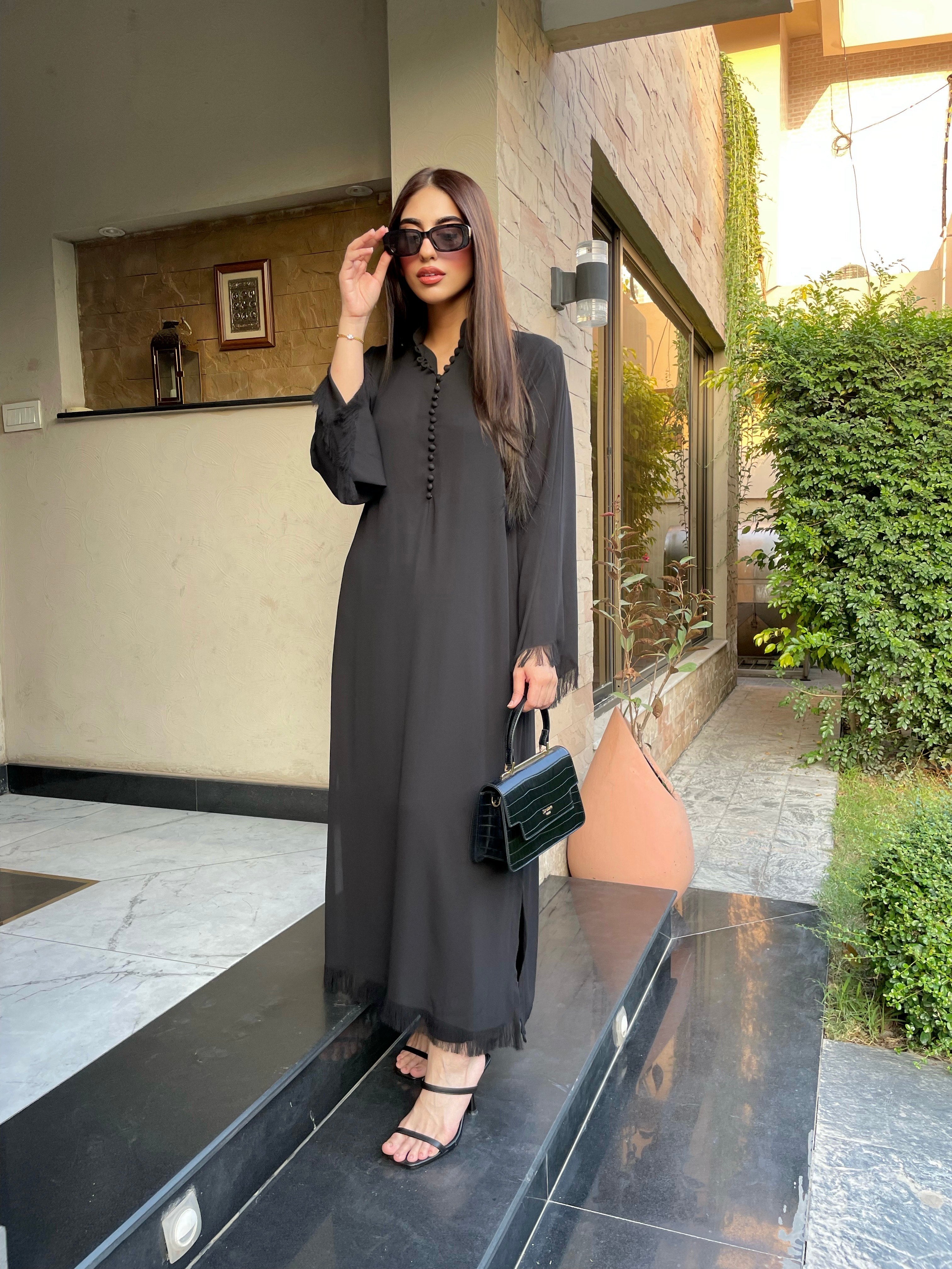 UAE delivery 
Dubai Delivery 
Pakistani brand delivering to UAE,
Basic 
Ready to wear
Pret wear 

black co-ord set loop  buttons and fringes .two pc black on crepe fabric offering by best online clothing brand in pakistan