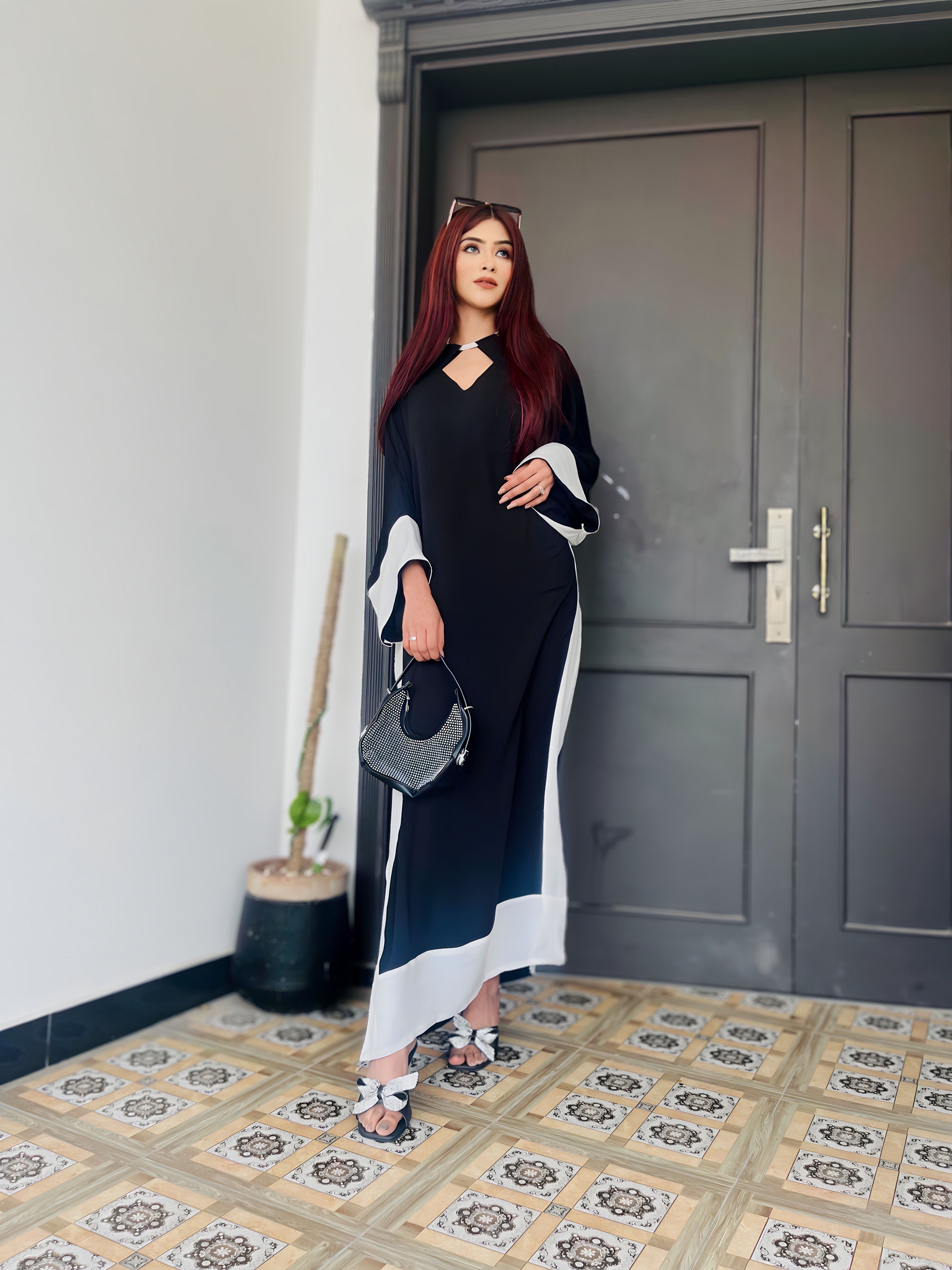 Pop of Black kaftan Momina Ammar