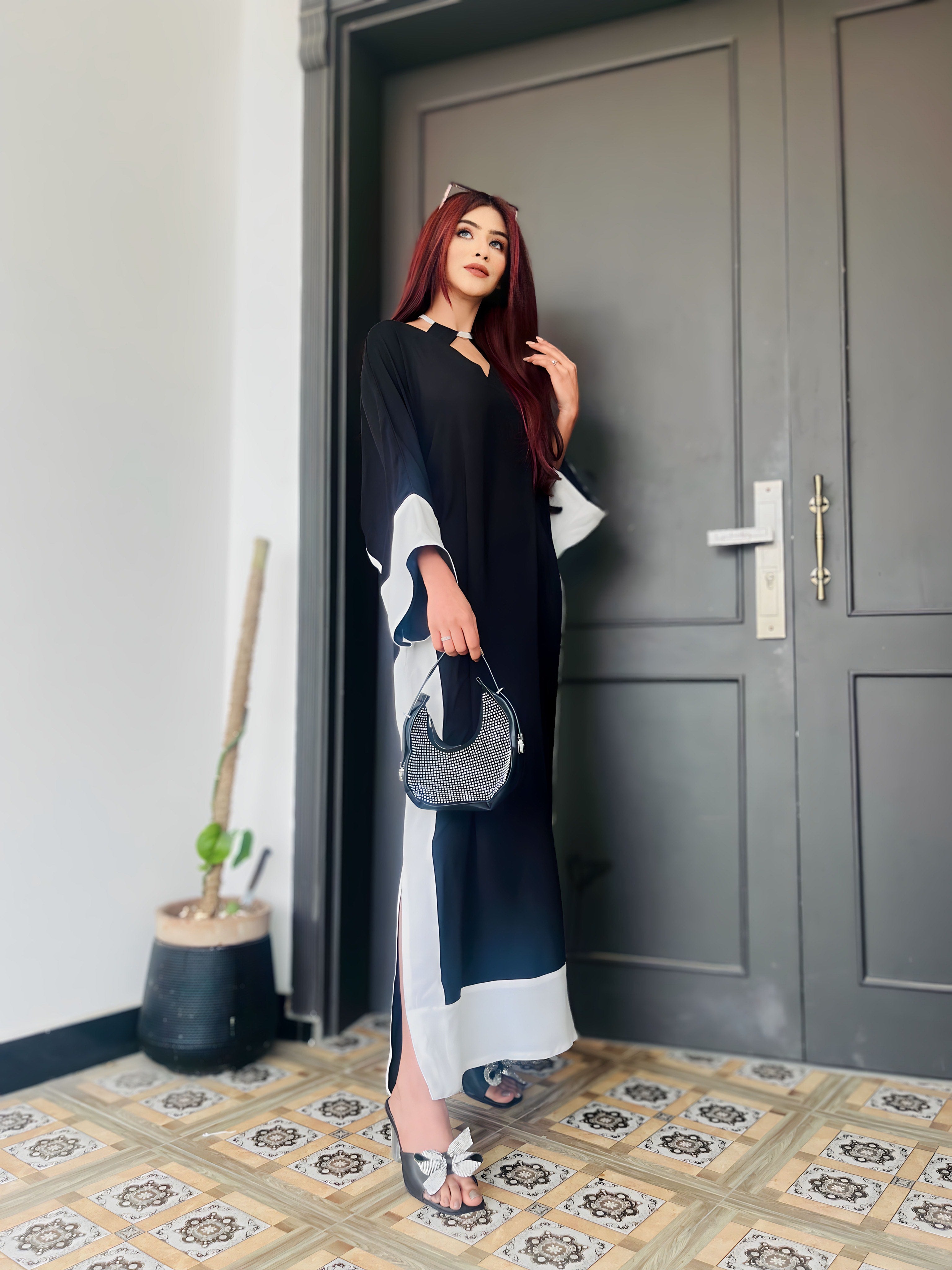 Pop of Black kaftan Momina Ammar