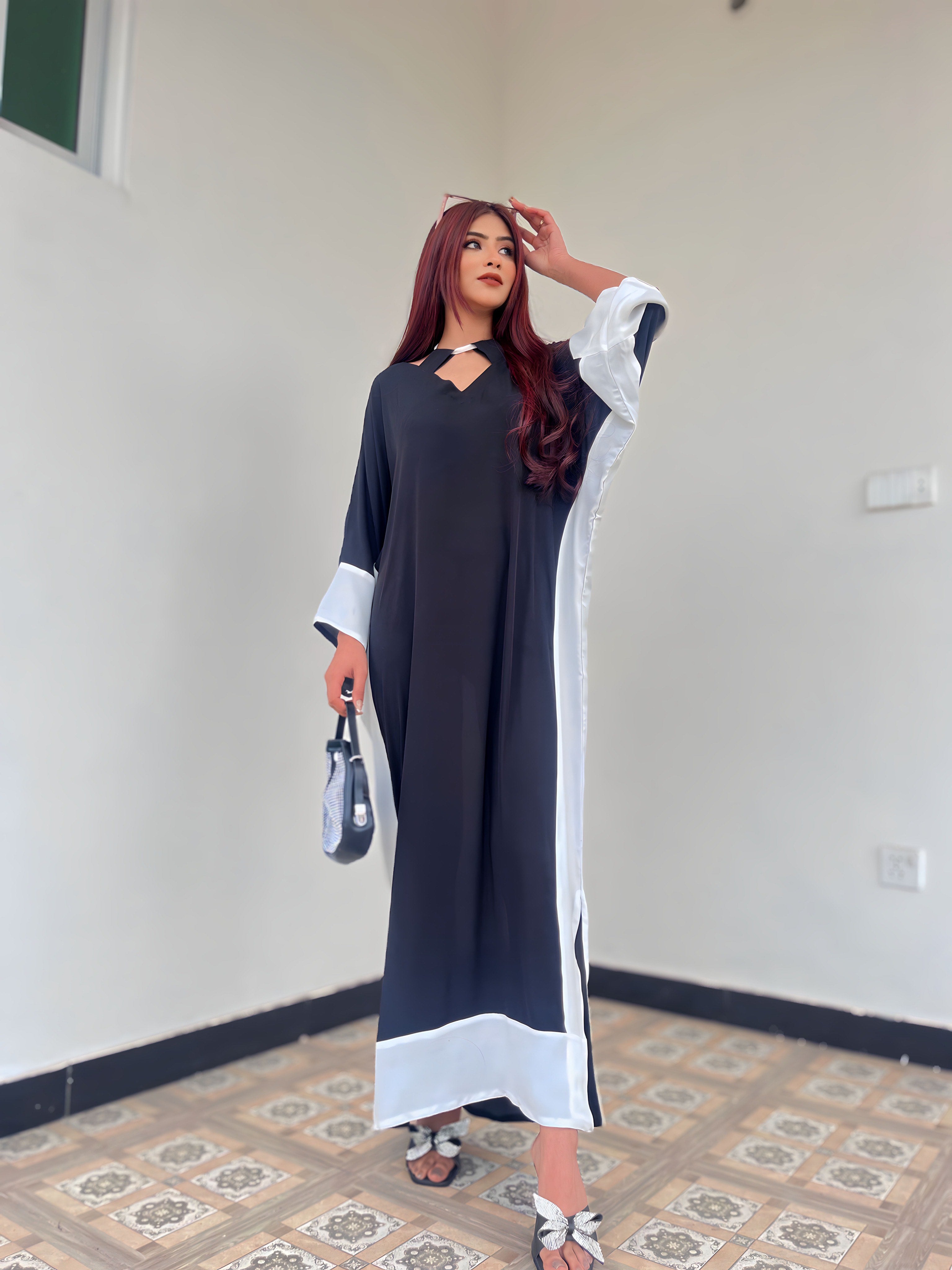 Pop of Black kaftan Momina Ammar