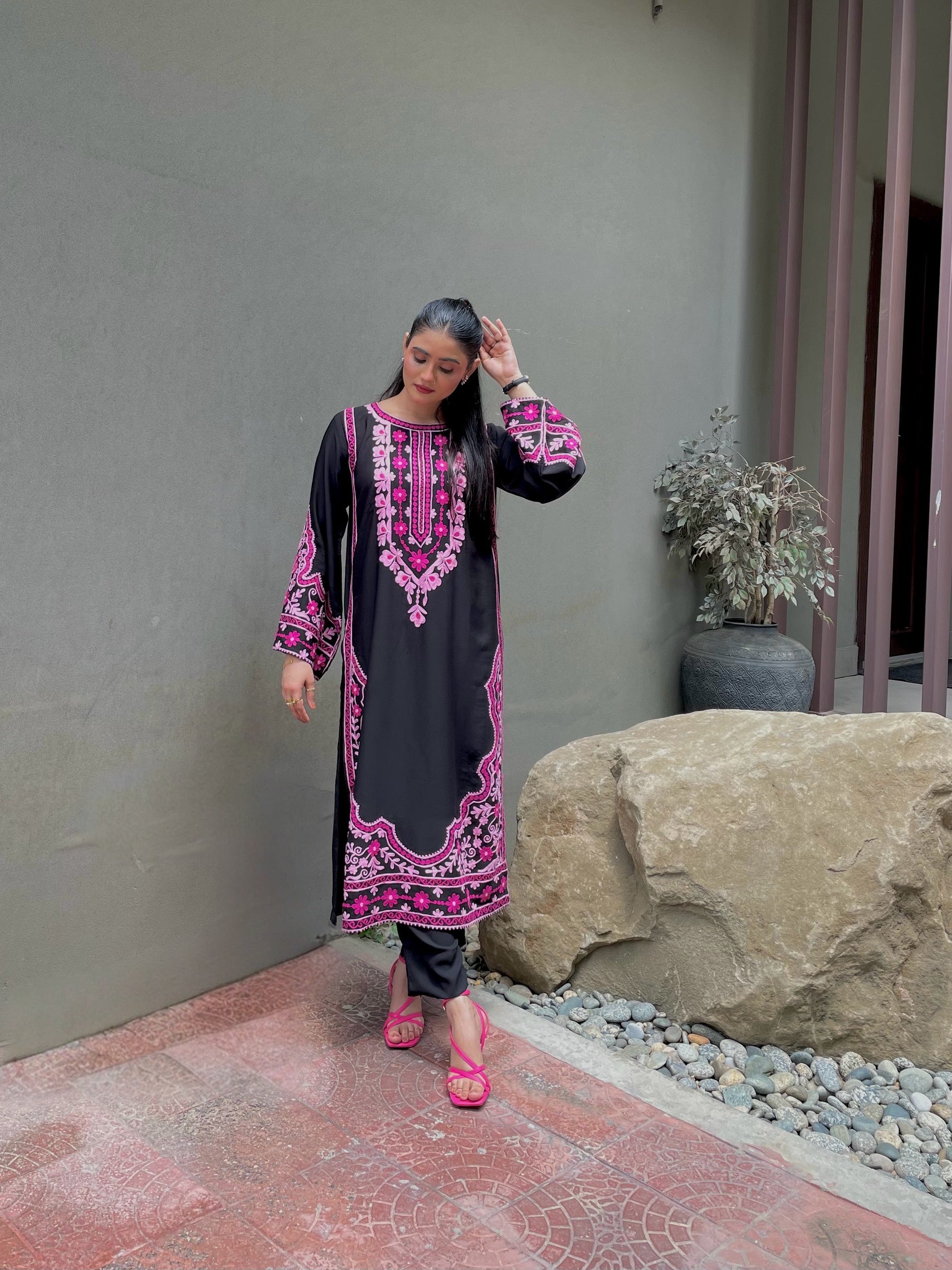 Model wearing black georgette embroidered designer kurta with vibrant pink and multicolour floral threadwork by Momina Ammar Clothing, a luxury Pakistani brand offering party wear and luxury pret outfits with worldwide delivery to UAE, UK, USA, and Canada.
Luxury georgette embroidered designer suit by Momina Ammar Clothing — premium lightweight georgette fabric with intricate embroidery, styled for party wear and elegant everyday looks, with worldwide delivery to UAE, UK, USA, and Canada.”