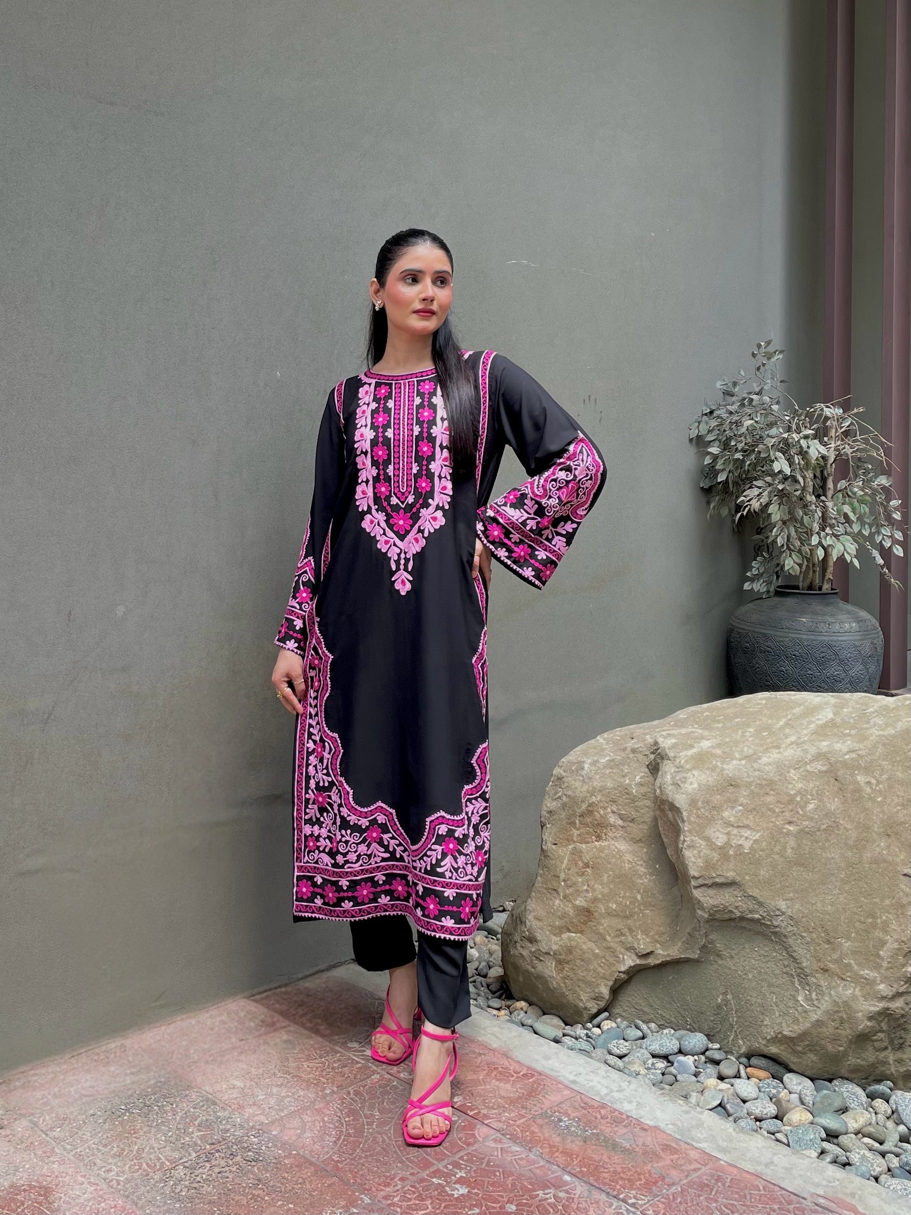 Model wearing black georgette embroidered designer kurta with vibrant pink and multicolour floral threadwork by Momina Ammar Clothing, a luxury Pakistani brand offering party wear and luxury pret outfits with worldwide delivery to UAE, UK, USA, and Canada.
Luxury georgette embroidered designer suit by Momina Ammar Clothing — premium lightweight georgette fabric with intricate embroidery, styled for party wear and elegant everyday looks, with worldwide delivery to UAE, UK, USA, and Canada.”